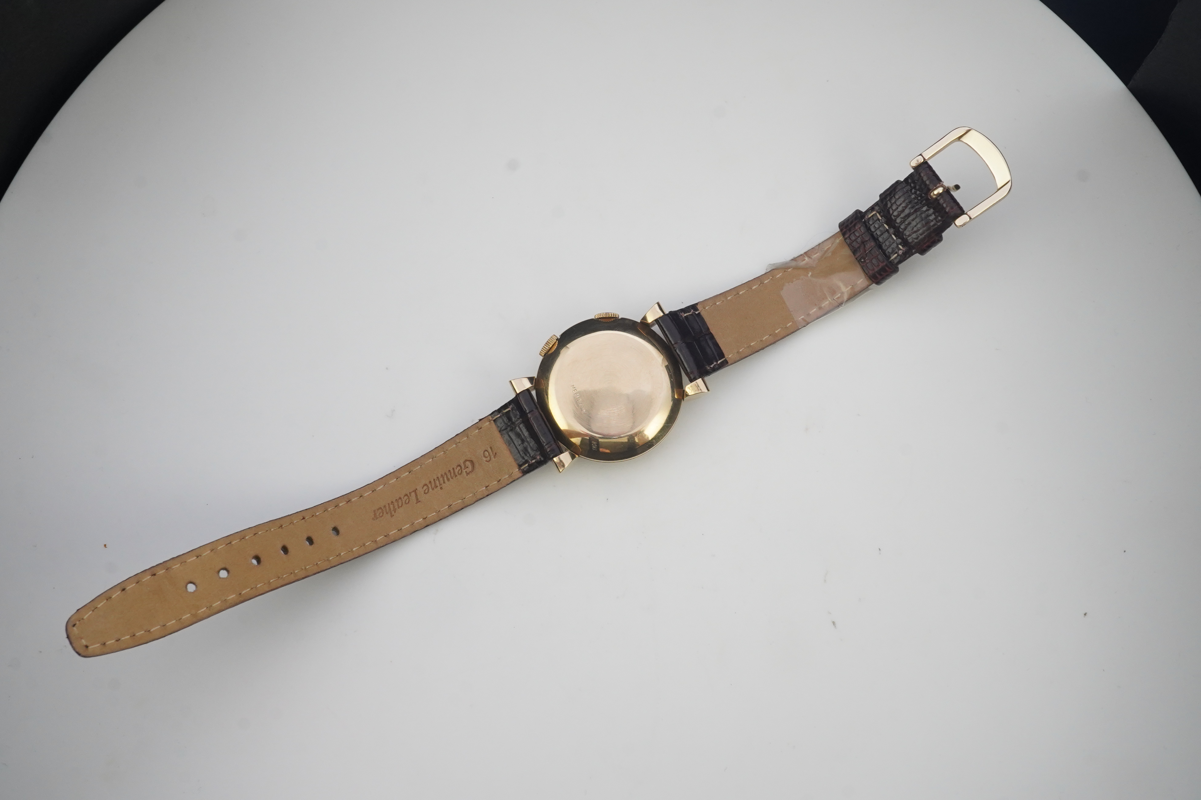 A gentleman's 1950's gold plated Jaeger LeCoultre Memovox manual wind wrist watch, on a later associated leather strap